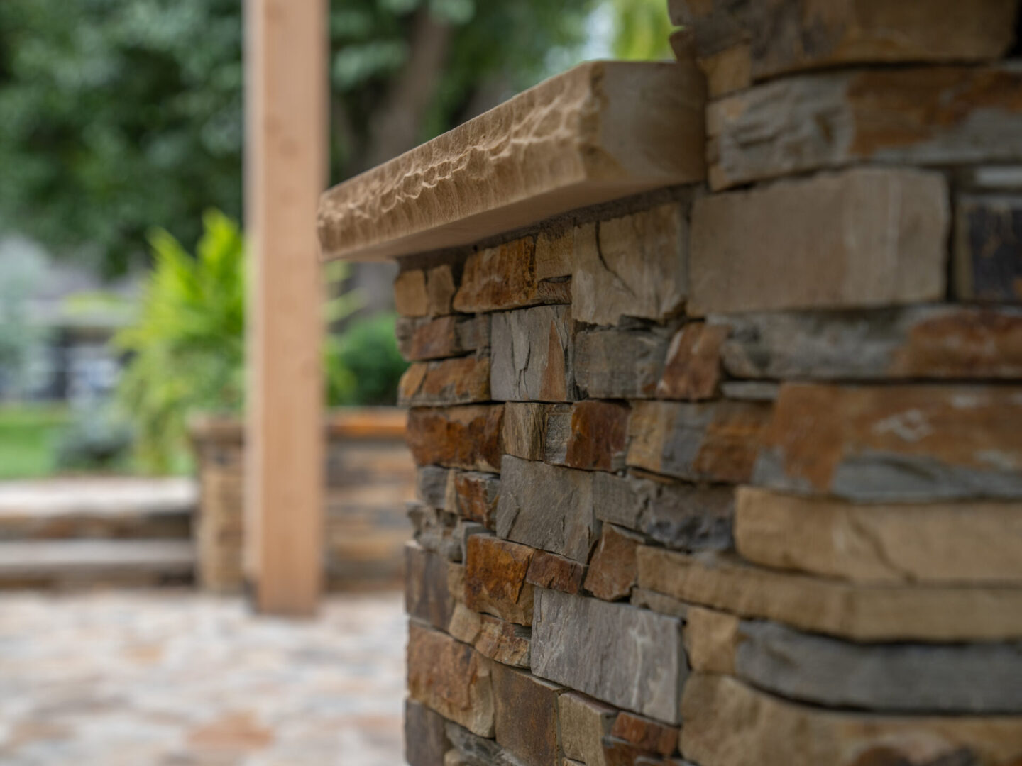 Close-up of a rustic stone wall with natural textures and earthy tones.